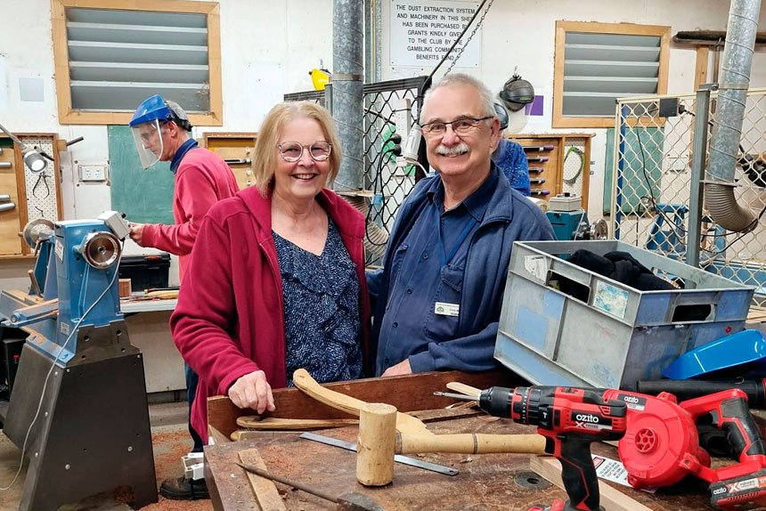 Darling Point Special School youth worker Tammy Carter and Bayside Wood Turners and Wood Crafters President Chris May embrace a new partnership, starting in October.
