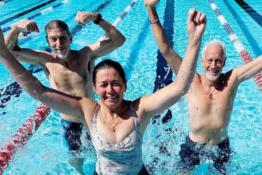 TAKING THE PLUNGE: Brett Smith, Michelle Maher and Gordon Lawrence in training at Cleveland for the swim-a-thon this Saturday.