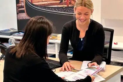 Mia Templey helping a client.