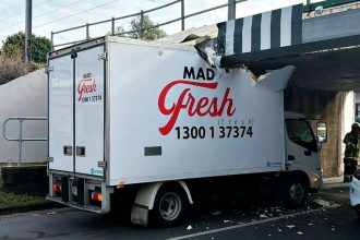 NOT AGAIN: A food delivery truck crashes into the Pine St Bridge protection beam.