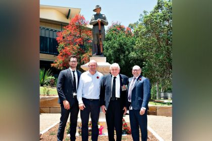 Iona College Leadership Team member Brayden Teece, stone mason Dan Gill, Old Boy and Manly-Lota RSL member Ted Barber and Michael Westlake attend the unveiling of the memorial.