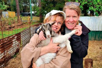 CUDDLE TIME: Patricia Harris says the goats are part of the family.