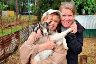 CUDDLE TIME: Patricia Harris says the goats are part of the family.