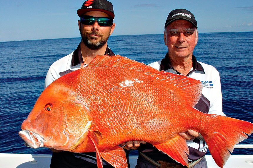 Greg Lamprecht and father Terry Lamprecht snag a 15kg red emperor off Fraser Island.