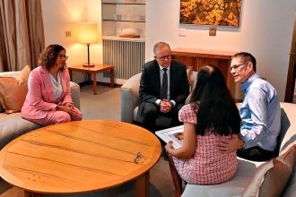 EMOTIONAL TIME: Employment Minister Amanda Rishworth and Prime Minister Anthony Albanese meet with Baby Priya’s parents at Parliament House in Canberra.