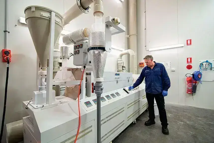 Senior site technician Des Broom operating a furnace used in the production of HPA at Lava Blue’s Alexandra Hills pilot plant.