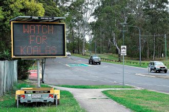 TAKE CARE: A sign warning motorists to be vigilant while driving through bushland containing a koala habitat.