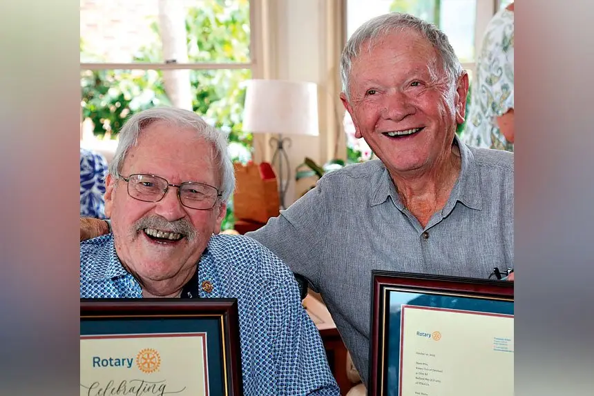 HAPPY TO HELP: James Pollock and Mario Peaver have been honoured for their many decades of service to Rotary.