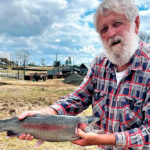 DAM GOOD: John Lee with a 4.8kg rainbow trout caught at a dam near Glen Innes.