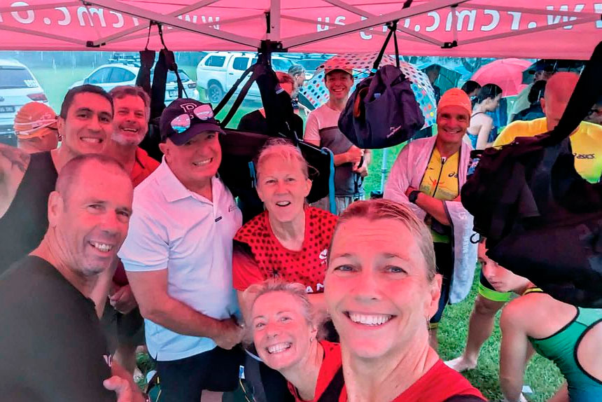 The RCMC Team sheltering from the torrential rain at the Robina Triathlon.