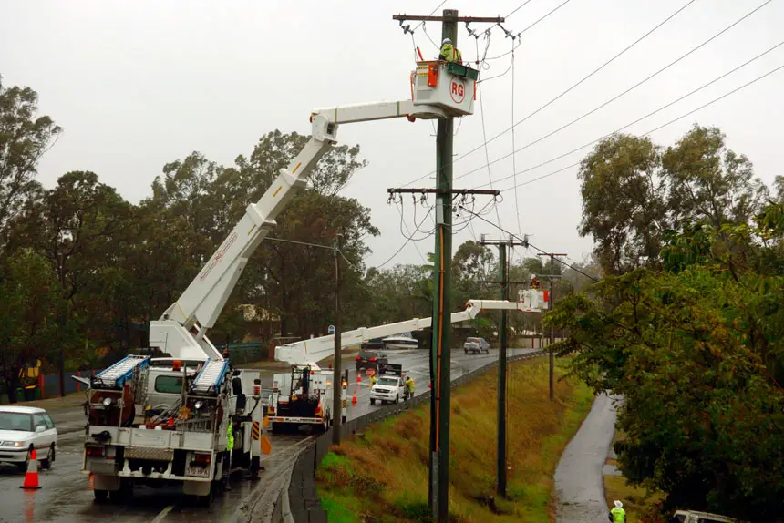 Electricity distributor, Energex crew work to fix powerlines on Buderim-Mooloolaba Road on the Sunshine Coast, Wednesday, Aug. 22, 2007. 7,700 homes were without power today mostly in areas of the Sunshine Coast and Brisbane's north, although there were just over 800 homes blacked out at Bellbowrie in Brisbane's west. (AAP Image/Sunshine Coast Daily, Michaela Glen) NO ARCHIVING, NLOUT