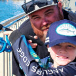 BEST MATES: Steve Smith and son Tye love to fish from the jetty near the car ferry at Redland Bay.