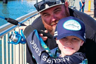 BEST MATES: Steve Smith and son Tye love to fish from the jetty near the car ferry at Redland Bay.