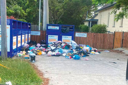 DUMPING GROUND: Bags of clothing and household items dumped around full Lifeline bins at Victoria Point.