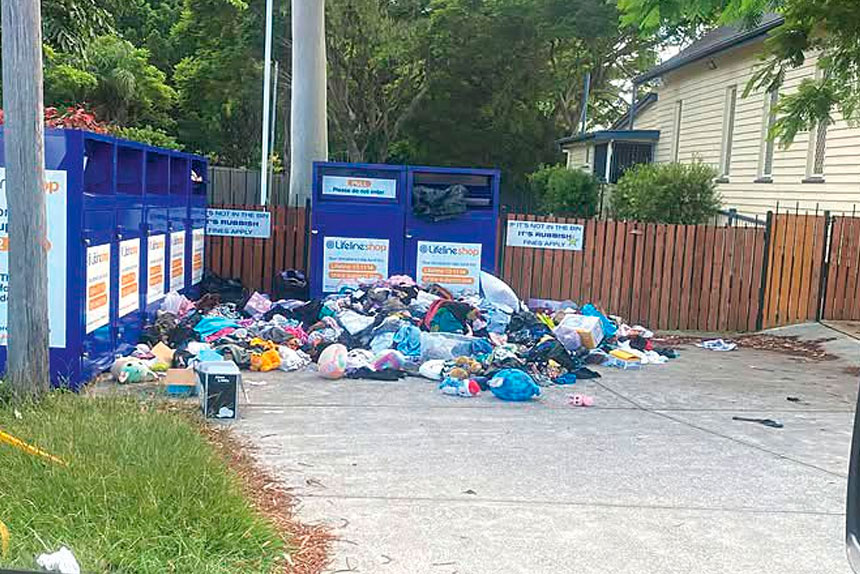 DUMPING GROUND: Bags of clothing and household items dumped around full Lifeline bins at Victoria Point.