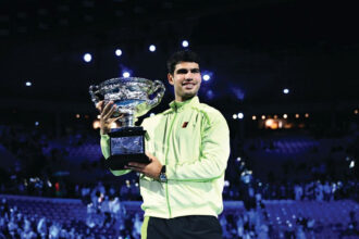 Carlos Alcaraz holds the trophy after winning the men’s singles final against Novak Djokovic at the 2026 Australian Open in Melbourne. PHOTO: AAP Image/Joel Carrett