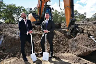 FOCUS ON CONSTRUCTION: Queensland Treasurer David Janetzki and the Minister for Housing and Public Works, Sam O’Connor, during a tour of a housing construction site.
