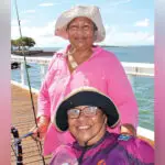 Cousins Madeline Solien-Suruman and Emily Tongla chat and fish as a means of keeping in touch at least once a week.