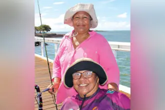 Cousins Madeline Solien-Suruman and Emily Tongla chat and fish as a means of keeping in touch at least once a week.