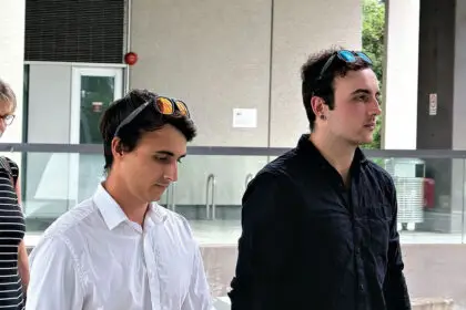 Jayden Relja, left, and Rylee Relja leave Brisbane Magistrates Court after giving evidence at a committal hearing for their mother Kylie Ellina Truswell-Mobbs on the charge of murder of her husband David Ronald Mobbs at Alexandra Hills. PHOTO: AAP Image/Rex Martinich