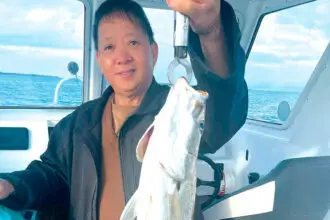 NICE CATCH: Peter Lou with a mulloway. Mr Lou fishes for the challenge and the thrill of not knowing what he is going to catch.