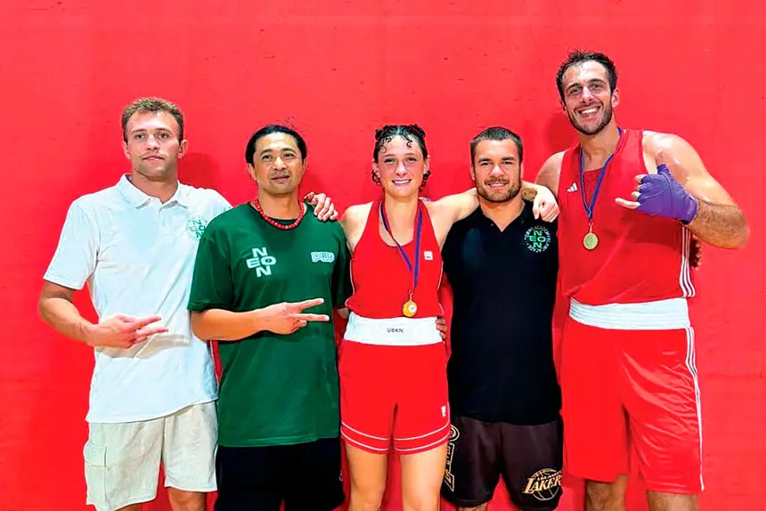 Novice champions Zahara Lane and Alessandro Lella with Neon coaches.