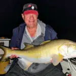 SURPRISE CATCH: A proud moment with a threadfin salmon caught in the Logan River.