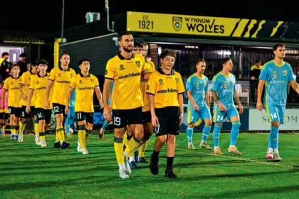 Alessandro Muscillo leads out the Wolves team against Gold Coast United.