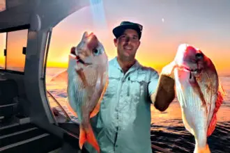 TWIN WIN: A proud Joe Di Salvo with two snapper he caught.