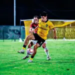 Wolves striker Fernando Nash shields the ball against Gold Coast Knights.