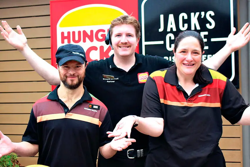 Sean Hennessy and Meagan Le Lay have celebrated a 20-year milestone of work at Hungry Jack’s, Alexandra Hills with store manager Tom Lane.
