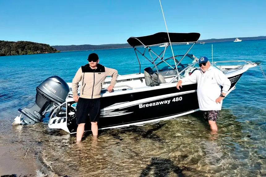 FAMILY FUN: Paul Hollingdale and his son Simon at Peel Island, just before the end of the snapper season.