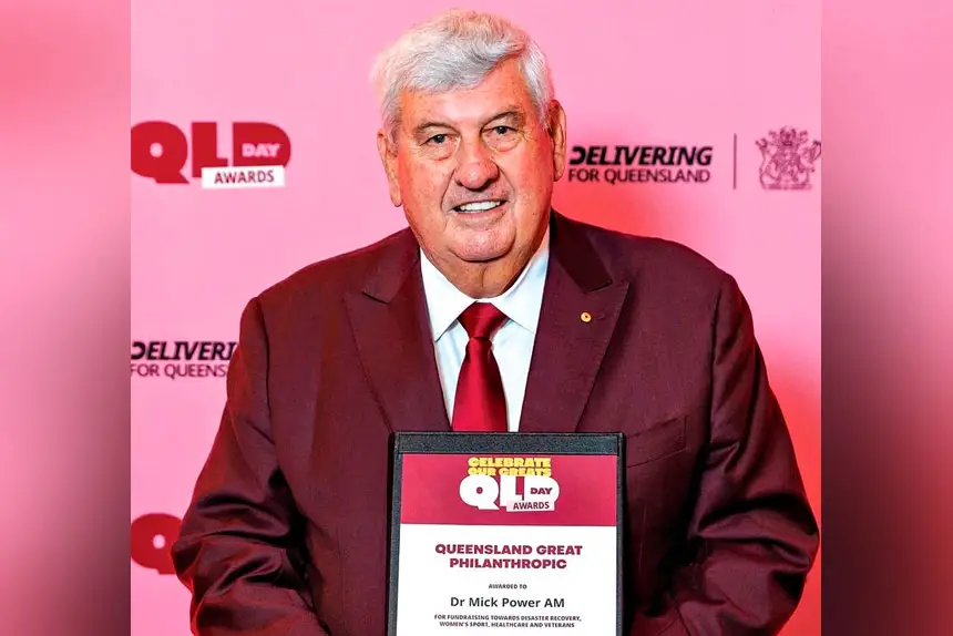 YEARS OF GIVING: A proud Mick Power with his 2026 Queensland Day Award.