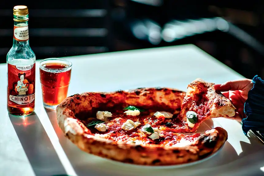 HARD TO BEAT: Pizza, Chinotto and a little bit of warmth again at munja pizza.