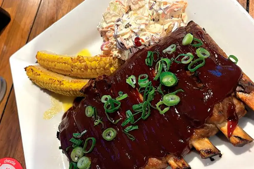 RACK ‘EM UP: BBQ pork ribs with coleslaw and corn ribs.