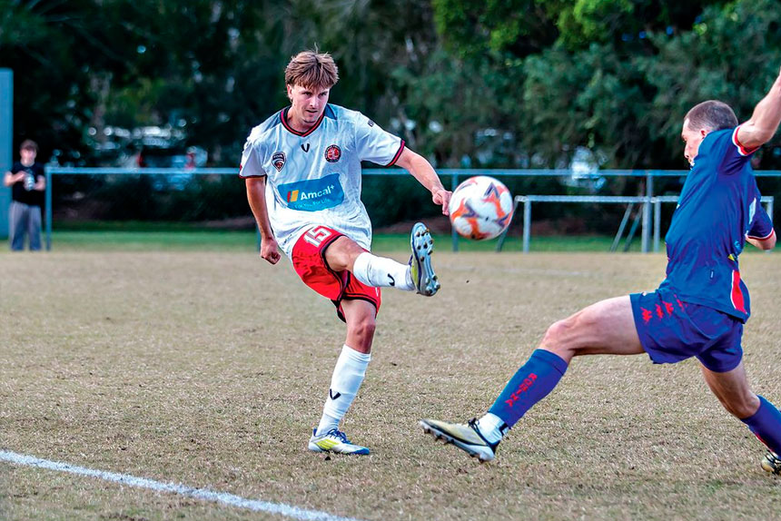 Redlands United goalscorer Bailey Paxton sends the ball forward in his side’s dramatic 1-1 draw with Robina City. PHOTO: Ray Gardner