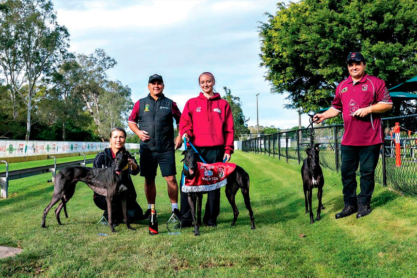 Trainer Jedda Cutlack with the winning dog Sheriff. Darren Sultana, trainer of third-placed Storms Will Roll, is pictured on far right. PHOTO: RaceQ Facebook