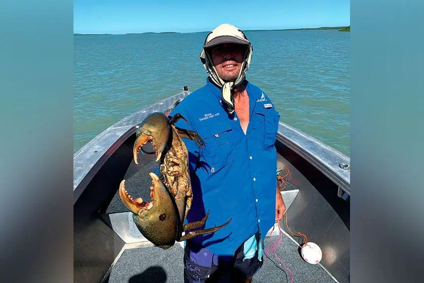 TASTY CATCH: Bruce Moore with a significant-sized crab, caught in the estuaries on Queensland’s central coast