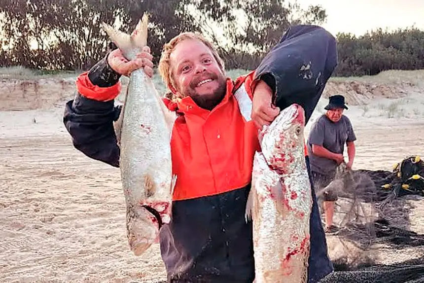 Marley Perry with some jew fish caught on Main Beach.