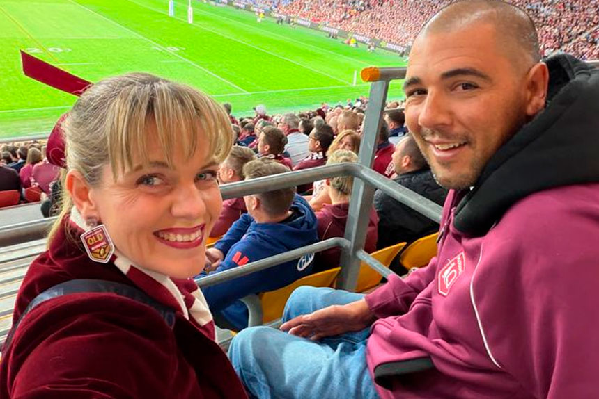 QUEENSLANDER!: Cr Alex Givney and husband Ben at the State of Origin decider.