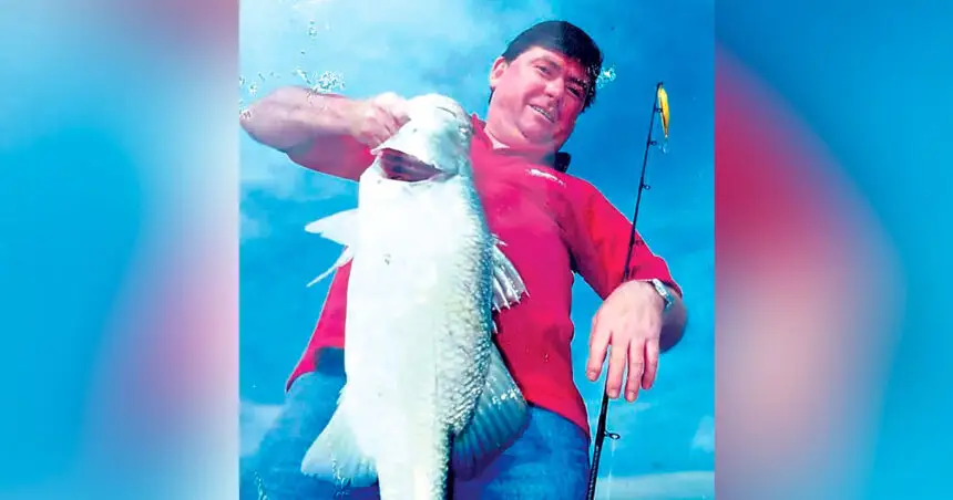 SUCCESSFUL AGAIN: Chris Whitehead with a barramundi caught off Darwin.