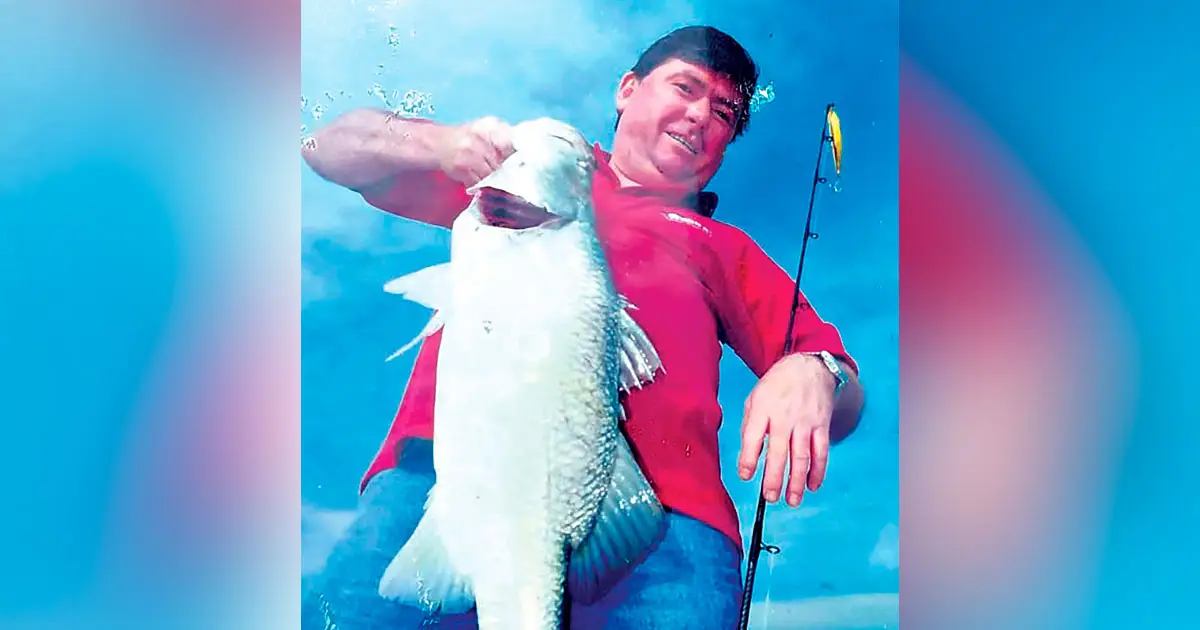 SUCCESSFUL AGAIN: Chris Whitehead with a barramundi caught off Darwin.