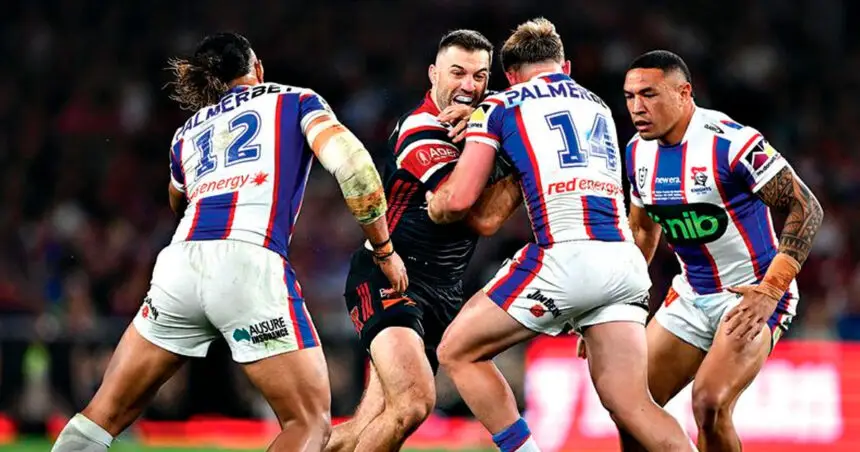 SO CLOSE: Wynnum-Manly product Harrison Graham tackles man of the match James Tedesco in the Roosters’ one point win over the Knights during the 2026 NRL grand final in Sydney on Sunday. (AAP Image/Dan Himbrechts)