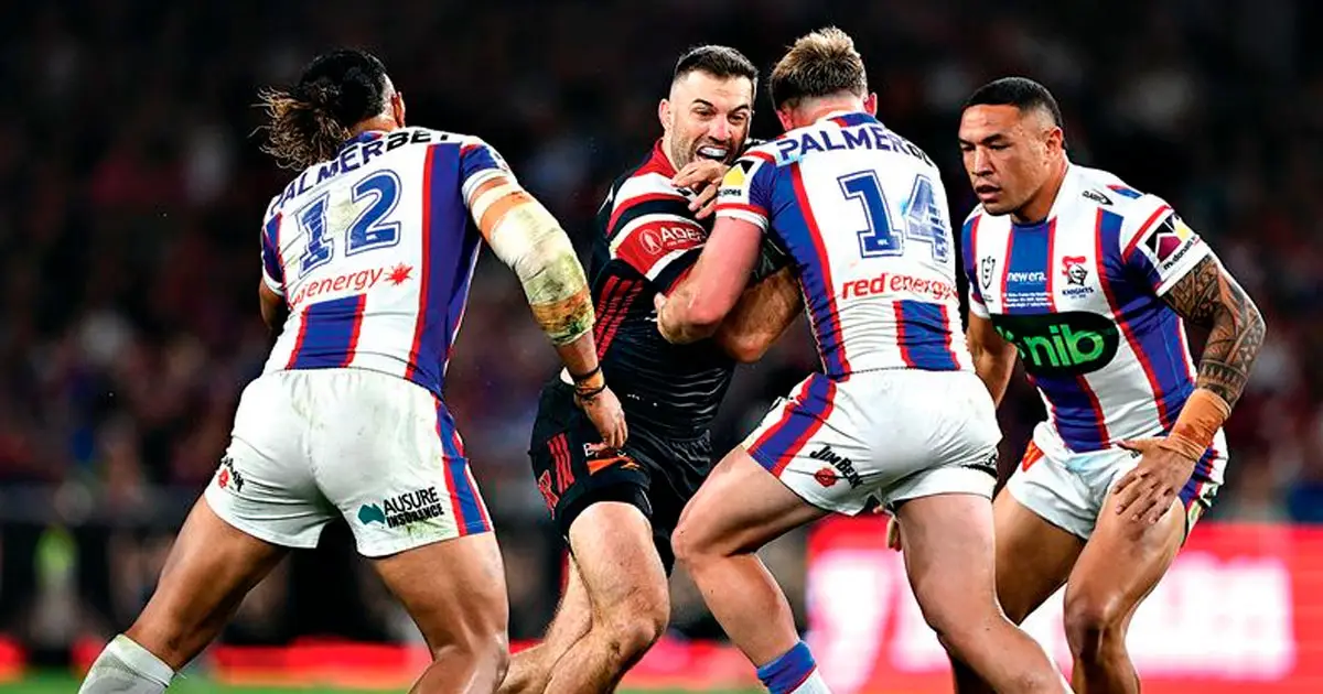 SO CLOSE: Wynnum-Manly product Harrison Graham tackles man of the match James Tedesco in the Roosters’ one point win over the Knights during the 2026 NRL grand final in Sydney on Sunday. (AAP Image/Dan Himbrechts)