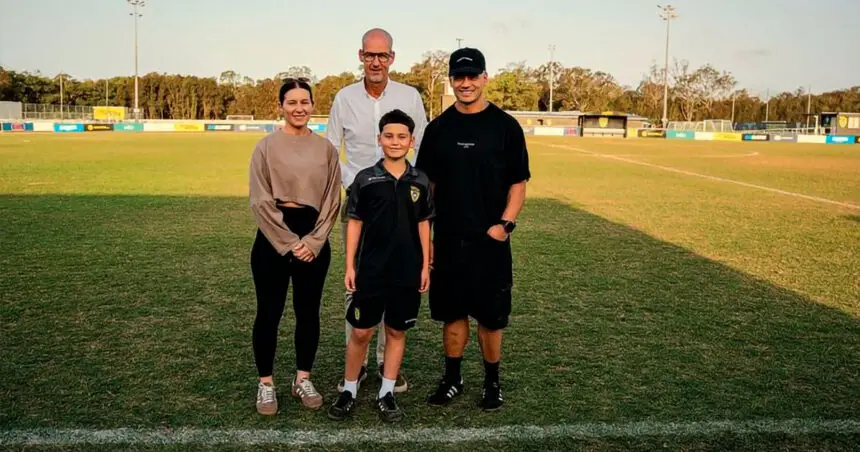 Xavian Petelo and his parents with Borussia Dortmund managing director Carsten Cramer.